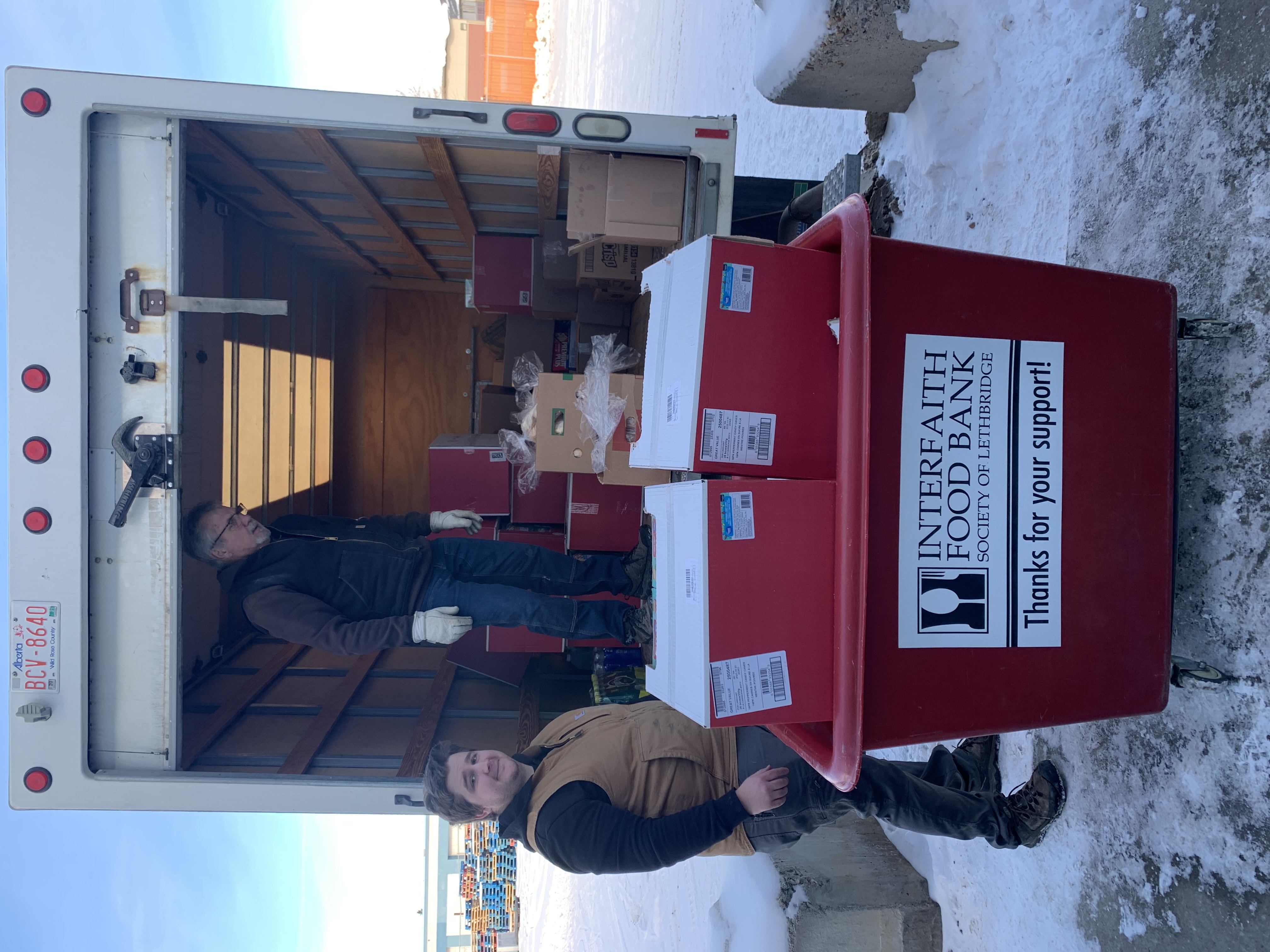 Food bankers in Lethbridge retrieving surplus food from a store